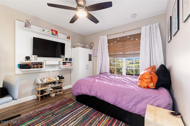 bedroom with ceiling fan and hardwood / wood-style flooring