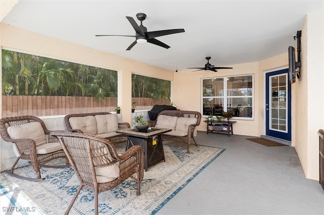 view of patio / terrace with an outdoor living space and ceiling fan