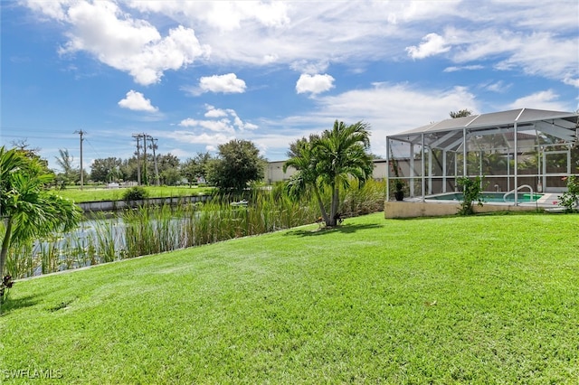 view of yard with glass enclosure