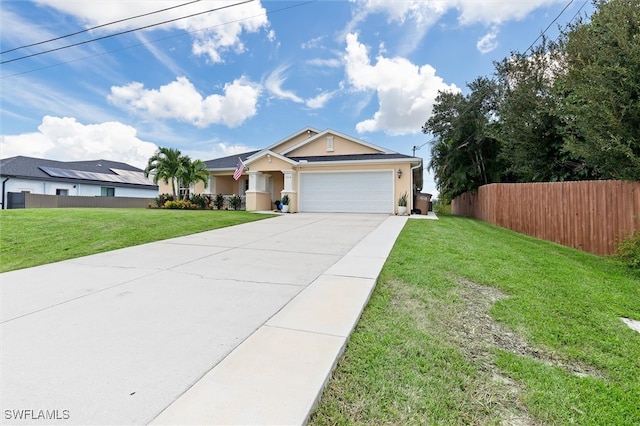 ranch-style home featuring a front lawn and a garage