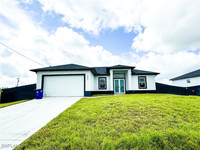 view of front facade featuring a garage and a front lawn