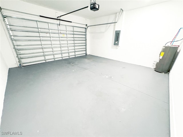 garage featuring a garage door opener, electric panel, and water heater