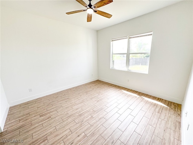 unfurnished room featuring ceiling fan and light hardwood / wood-style floors