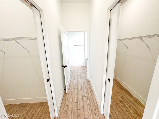 hall with light hardwood / wood-style flooring