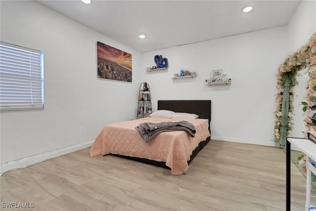 bedroom with light wood-type flooring