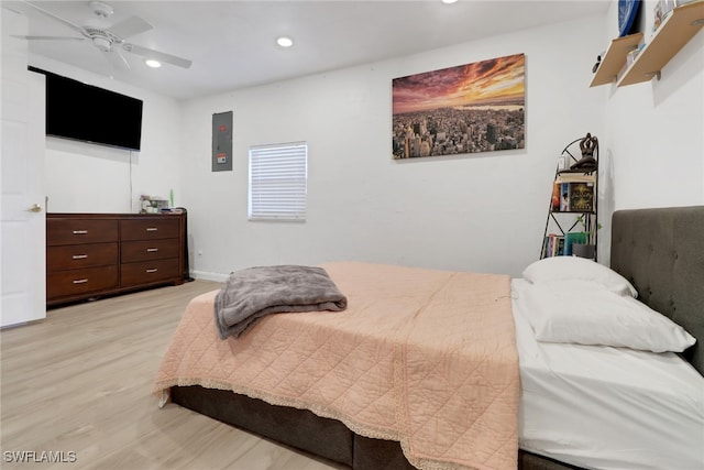 bedroom with light wood-type flooring and ceiling fan