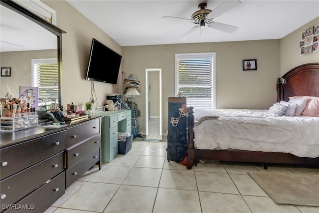 bedroom with light tile patterned floors and ceiling fan