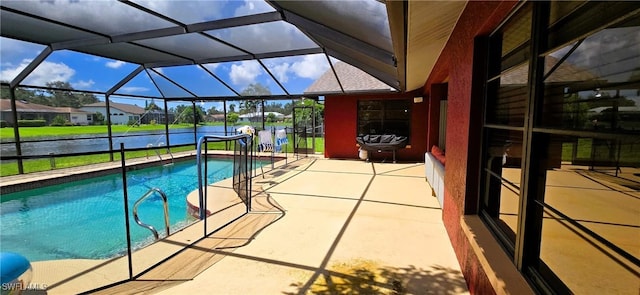 view of pool with a patio and a lanai