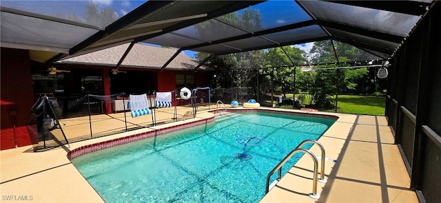 view of swimming pool featuring a patio, ceiling fan, and a lanai