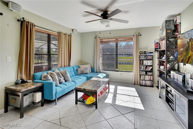 tiled living room featuring ceiling fan