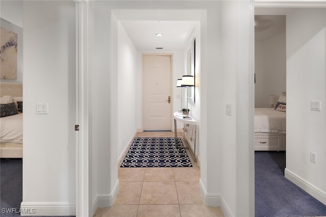 corridor with light tile patterned flooring