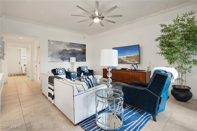 tiled living room featuring ceiling fan and ornamental molding