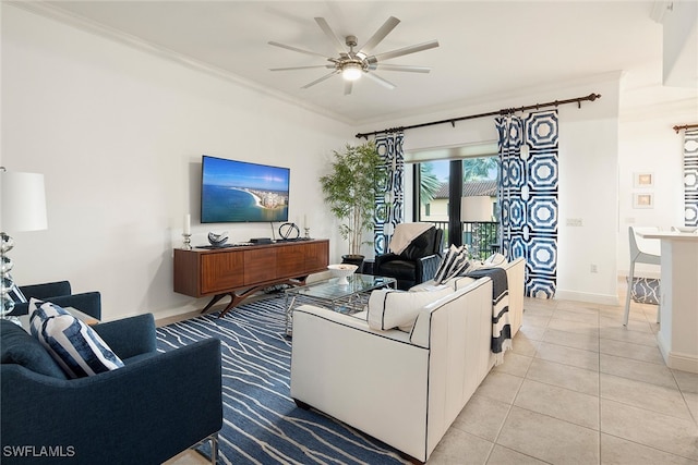 tiled living room with ceiling fan and crown molding