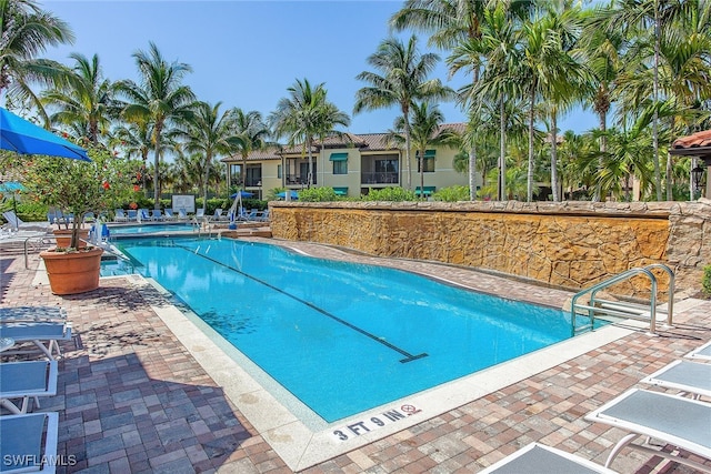 view of swimming pool featuring a patio area