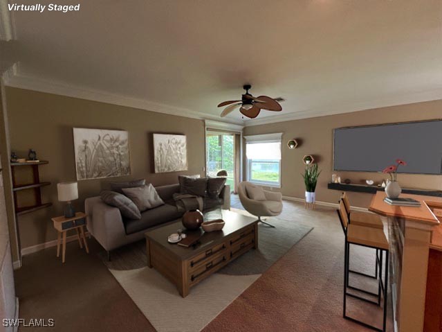 carpeted living room featuring ceiling fan and ornamental molding