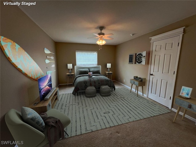 carpeted bedroom featuring ceiling fan