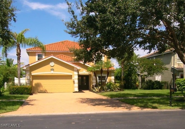 mediterranean / spanish home featuring a front lawn