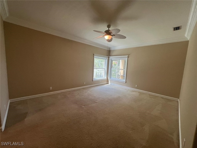 empty room with crown molding, ceiling fan, and light colored carpet