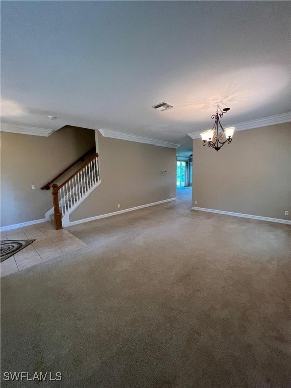 unfurnished living room featuring ornamental molding, an inviting chandelier, and light colored carpet