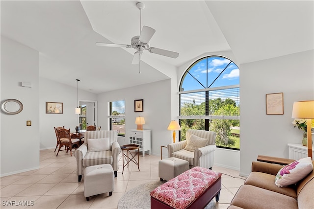 living room featuring lofted ceiling, ceiling fan, light tile patterned flooring, and a healthy amount of sunlight