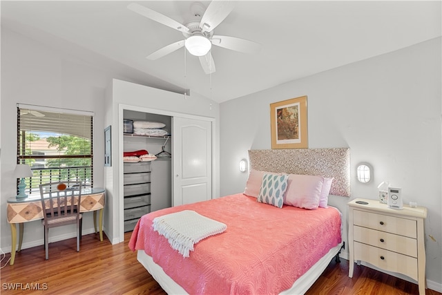 bedroom featuring lofted ceiling, hardwood / wood-style floors, ceiling fan, and a closet