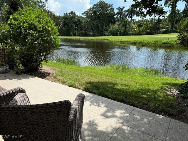 view of patio with a water view