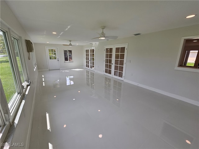 unfurnished room with french doors, ceiling fan, and tile patterned floors