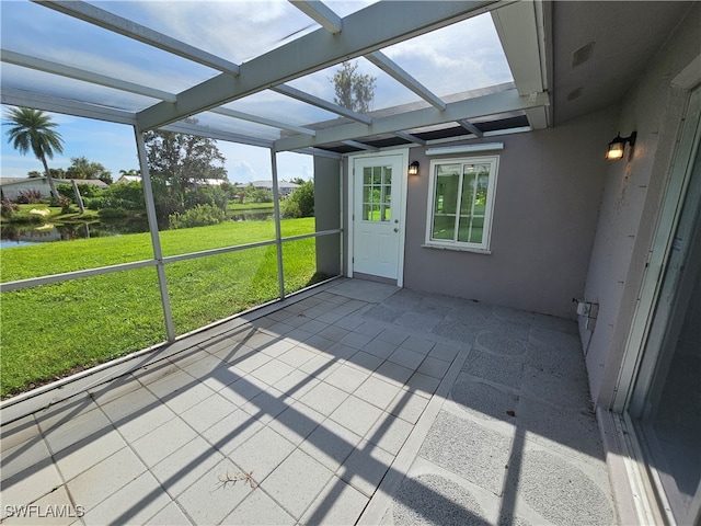 unfurnished sunroom featuring a wealth of natural light