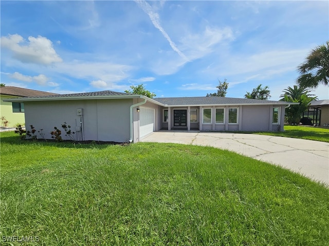 ranch-style house with a front lawn and a garage