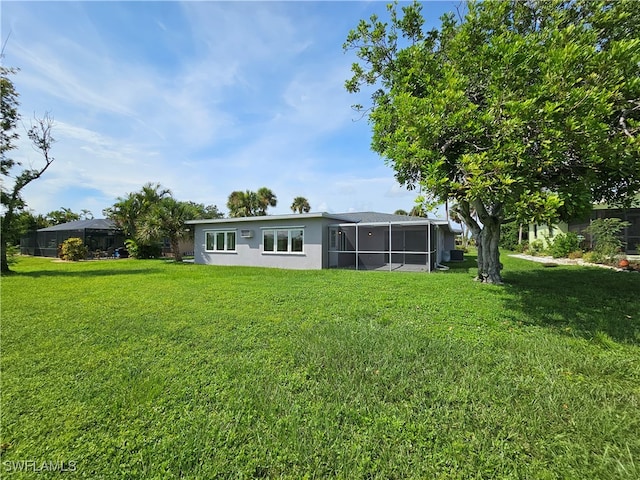 view of yard featuring a sunroom