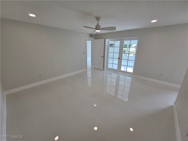 empty room featuring a textured ceiling, ceiling fan, light tile patterned floors, and french doors