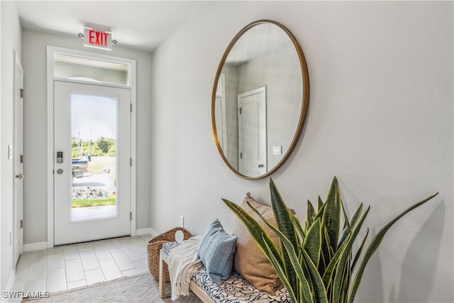 entryway with light tile patterned floors