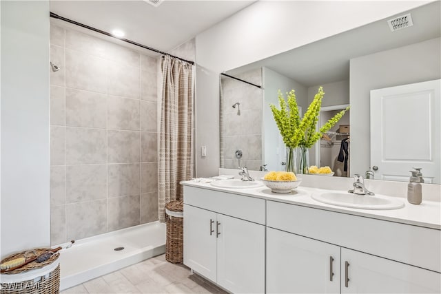 bathroom with vanity and walk in shower