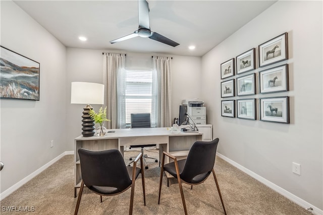 carpeted office featuring ceiling fan