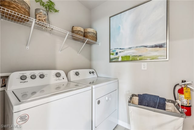 laundry room with washing machine and clothes dryer