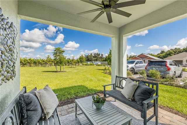 view of patio featuring ceiling fan