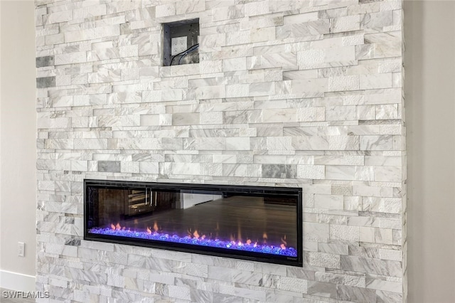 room details featuring a stone fireplace