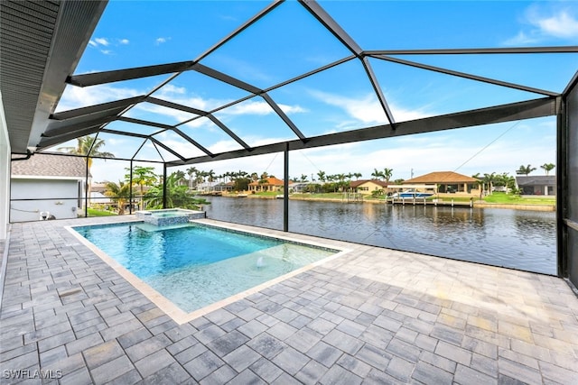 view of swimming pool with glass enclosure, an in ground hot tub, a patio area, and a water view