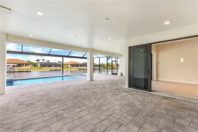 view of pool with a water view