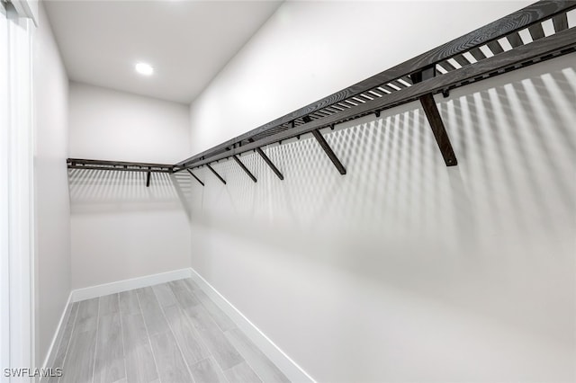 spacious closet featuring hardwood / wood-style floors