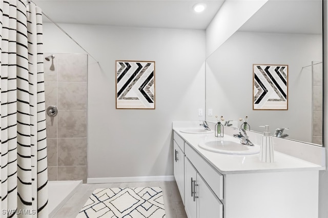 bathroom featuring curtained shower and vanity