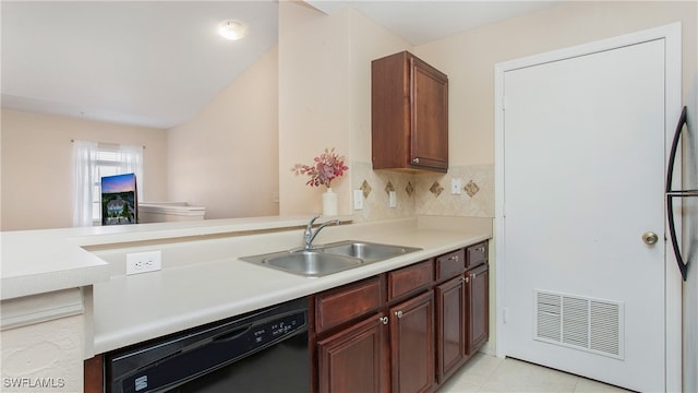 kitchen featuring black dishwasher, sink, kitchen peninsula, backsplash, and light tile patterned floors