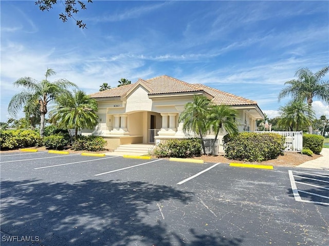 view of property with uncovered parking