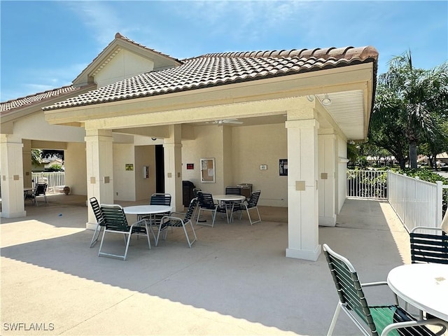 view of patio featuring fence and outdoor dining area