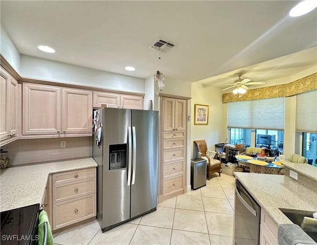 kitchen featuring ceiling fan, light tile patterned flooring, stainless steel appliances, visible vents, and open floor plan