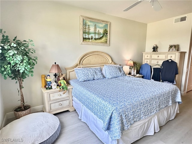 bedroom featuring light hardwood / wood-style floors and ceiling fan