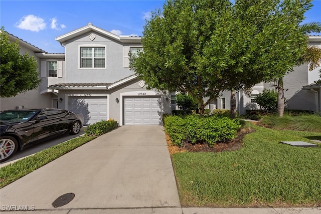 view of front facade with a garage and a front yard