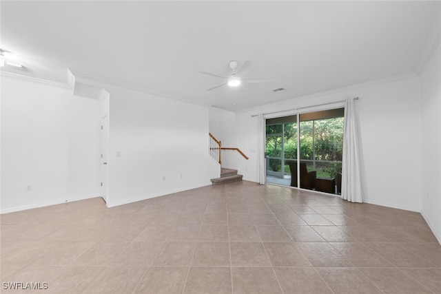 tiled spare room with crown molding and ceiling fan