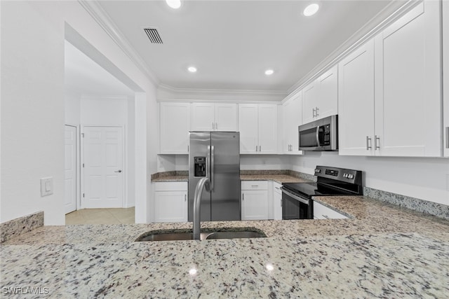 kitchen featuring ornamental molding, white cabinetry, sink, light stone countertops, and appliances with stainless steel finishes