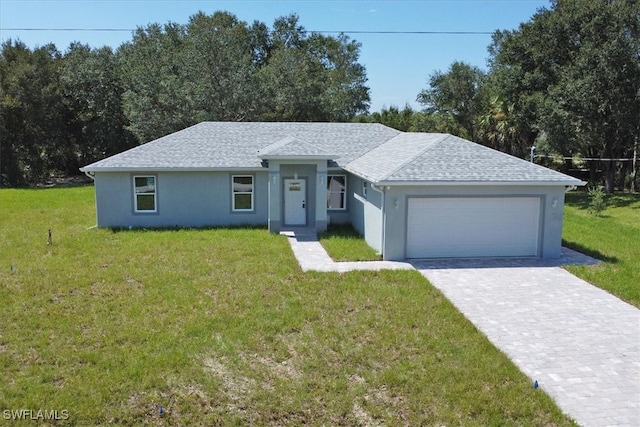 ranch-style house with a front yard and a garage